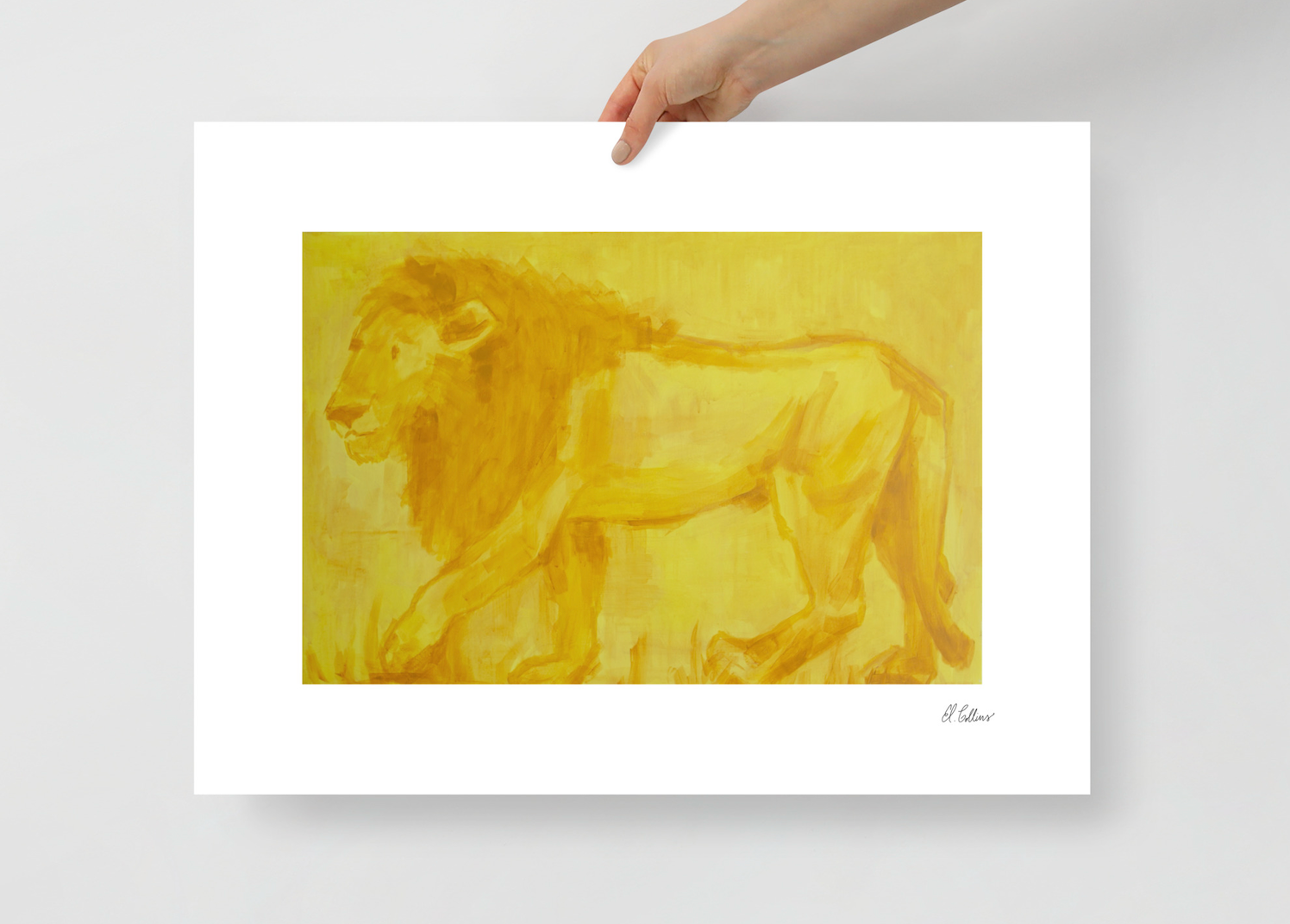 lion art print being held by hand